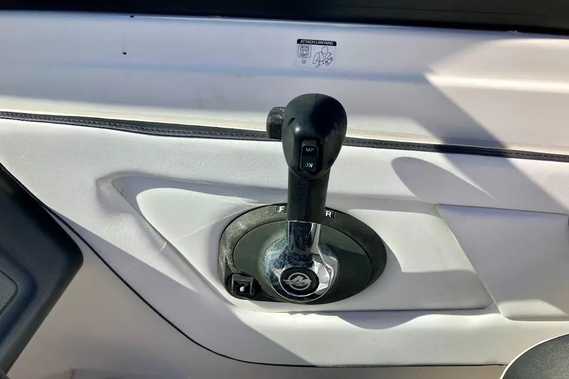 Slide: The Image of Throttle control lever on a 2017 Sea Ray 19 SPX OB boat. - 14