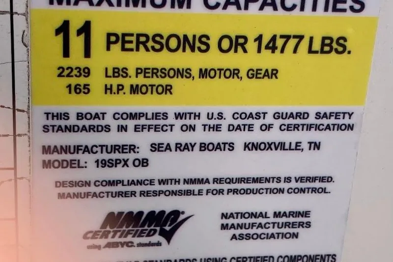 Slide: The Image of Sea Ray 19 SPX OB 2017 capacity label: 11 persons, 1477 lbs, 165 HP motor. - 15