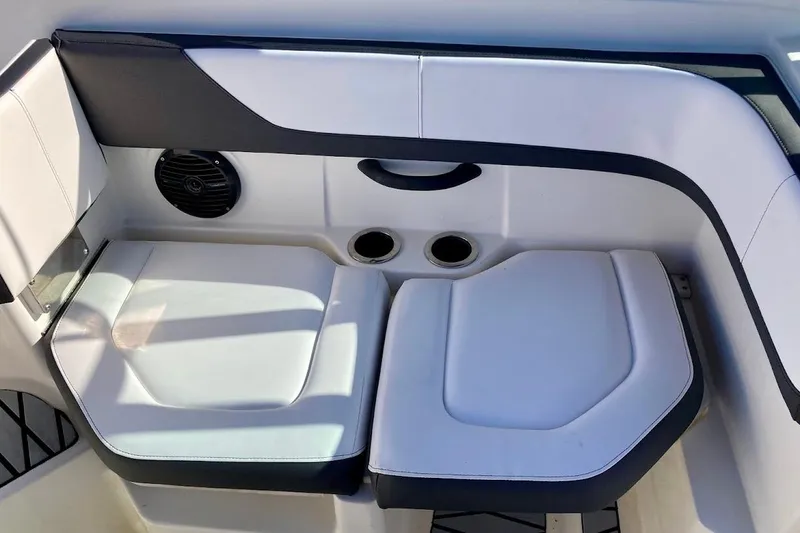 Slide: The Image of 2017 Sea Ray 19 SPX OB boat seating area with cup holders and speaker. - 16