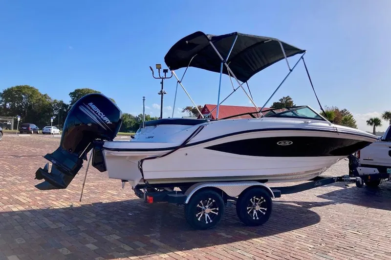 Slide: The Image of 2017 Sea Ray 19 SPX OB boat on trailer with outboard motor and canopy. - 3