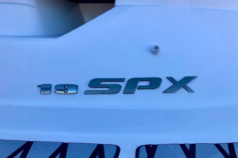 Slide: The Image of 2017 Sea Ray 19 SPX OB boat emblem on white surface. - 4