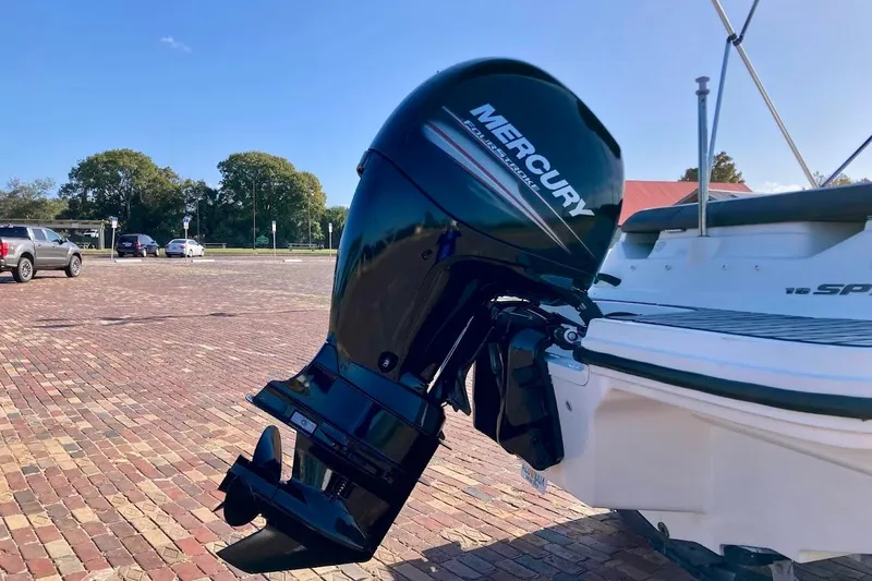 Slide: The Image of 2017 Sea Ray 19 SPX OB with Mercury outboard engine in a sunny parking lot. - 6