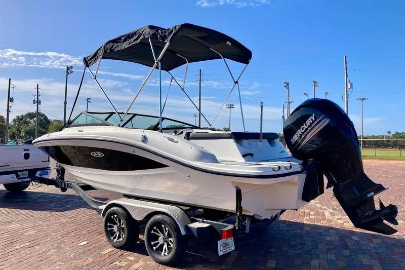 Slide: The Image of 2017 Sea Ray 19 SPX OB boat with Mercury outboard engine on a trailer. - 8