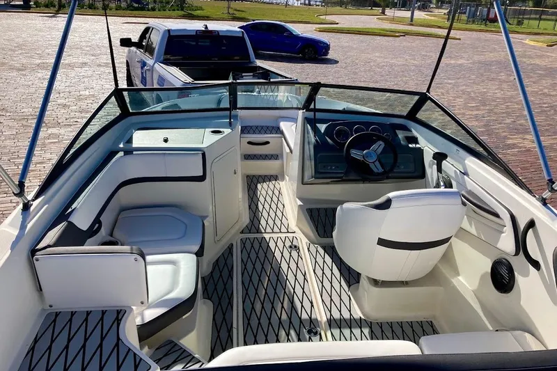 Slide: The Image of 2017 Sea Ray 19 SPX OB boat interior with steering wheel and seating. - 9