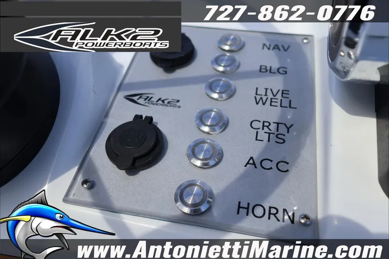 Slide: The Image of Control panel of 2026 ALK2 Powerboats 18 CRS Center Console with various switches. - 19