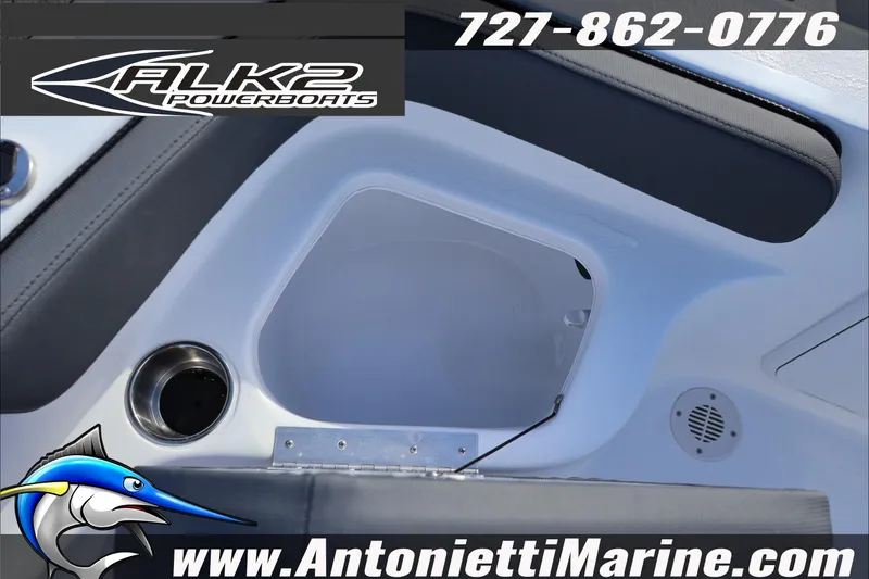 Slide: The Image of 2026 ALK2 Powerboats 18 CRS Center Console interior with cup holder and speaker. - 24