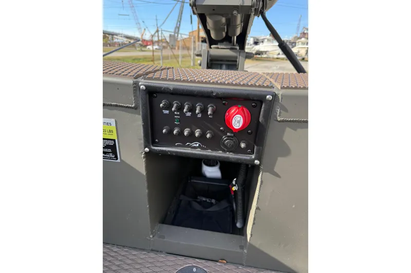 Slide: The Image of Control panel of 2026 Gator Tail 1748 Gator Series boat, featuring switches and red ignition. - 6