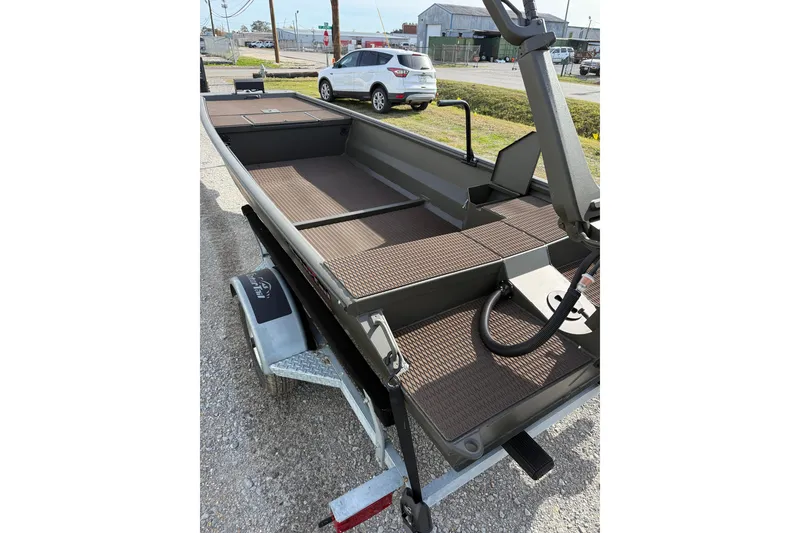 Slide: The Image of 2026 Gator Tail 1748 Gator Series boat on trailer, parked outdoors. - 7