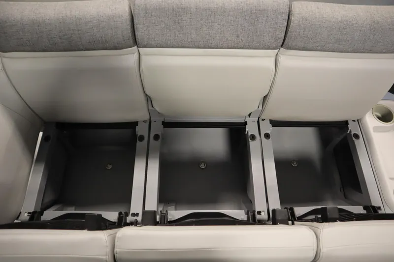 Slide: The Image of 2024 Sea-Doo Switch Cruise 21 storage compartments under gray and white seats. - 12