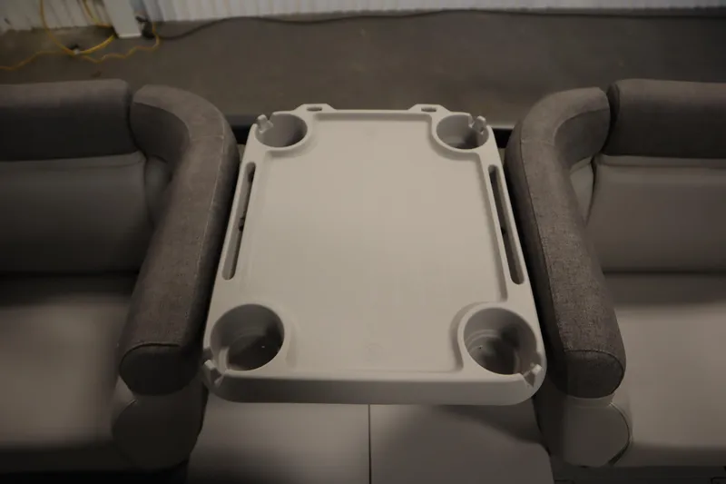 Slide: The Image of 2024 Sea-Doo Switch Cruise 21 interior with table and cup holders. - 15