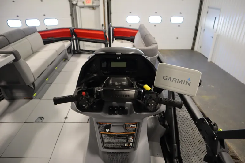 Slide: The Image of 2024 Sea-Doo Switch Cruise 21 interior with Garmin navigation system and spacious seating. - 17