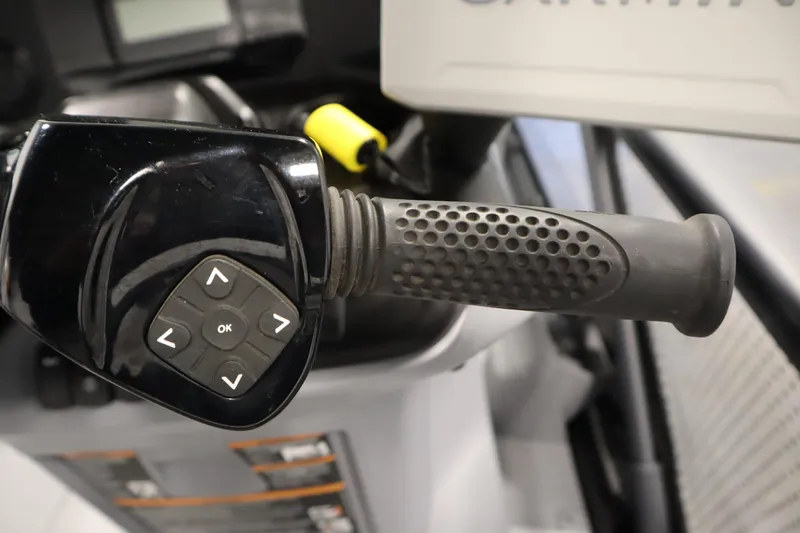 Slide: The Image of Close-up of 2024 Sea-Doo Switch Cruise 21 handlebar with control buttons. - 20