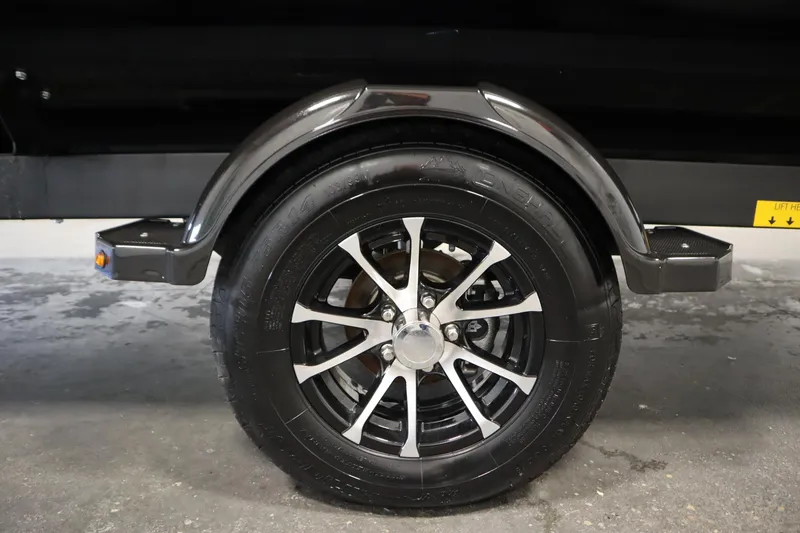 Slide: The Image of 2024 Sea-Doo Switch Cruise 21 trailer wheel with sleek black and silver alloy design. - 33