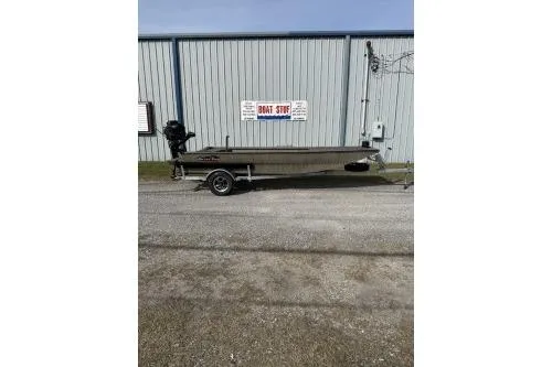 The Image of 2026 Gator Tail 1754 Extreme boat on trailer, parked outside a metal building. - 1