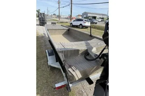Slide: The Image of 2026 Gator Tail 1754 Extreme boat on trailer, parked outdoors. - 3