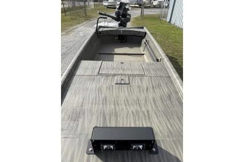 Slide: The Image of 2026 Gator Tail 1754 Extreme boat with open deck and motor, parked outdoors. - 5