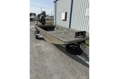 Slide: The Image of 2026 Gator Tail 1754 Extreme boat on trailer near industrial building. - 6