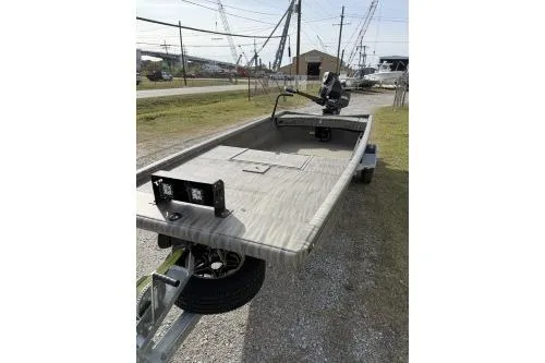Slide: The Image of 2026 Gator Tail 1754 Extreme boat on trailer, parked outdoors. - 7