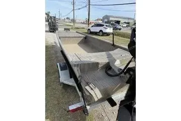 Slide: The Image of 2026 Gator Tail 1754 Extreme boat on trailer, parked outdoors. - 9