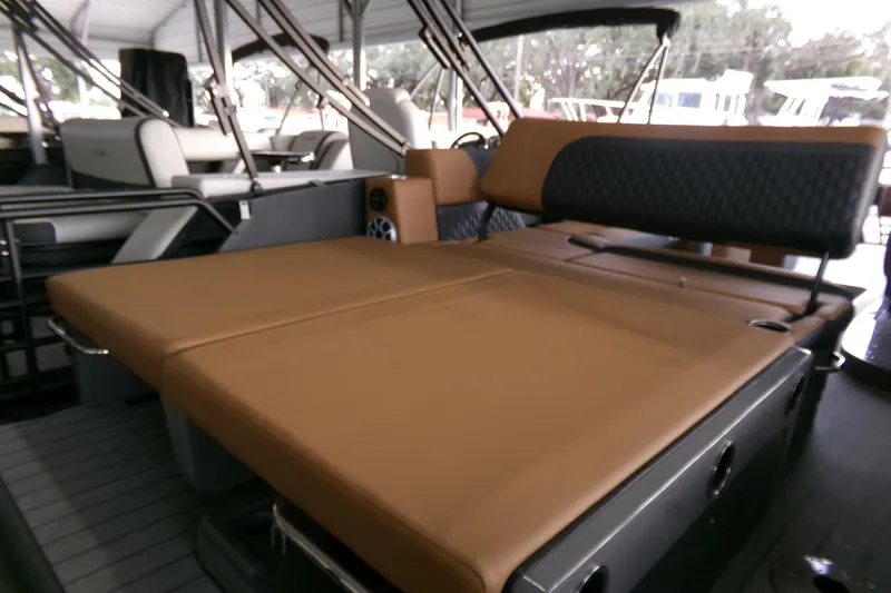 Slide: The Image of 2026 Sylvan L3 DLZ Bar boat interior with tan seating and modern design. - 10