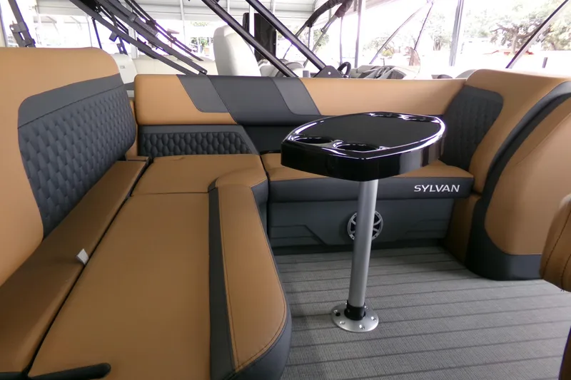 Slide: The Image of Luxurious interior of 2026 Sylvan L3 DLZ Bar pontoon boat with stylish seating and table. - 3