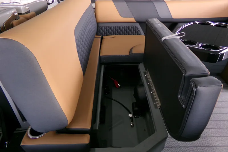 Slide: The Image of 2026 Sylvan L3 DLZ Bar boat interior with storage compartment and cup holders. - 4