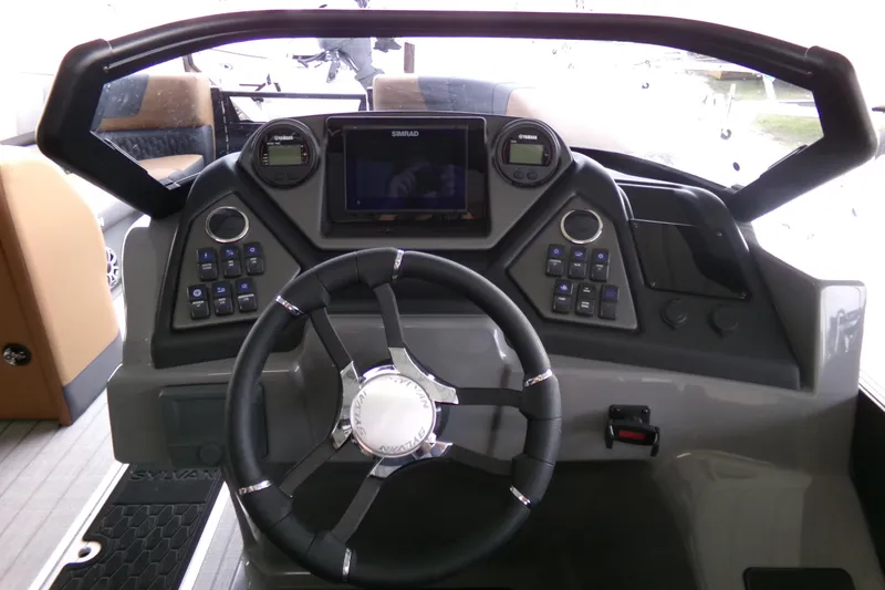 Slide: The Image of 2026 Sylvan L3 DLZ Bar boat dashboard with steering wheel and control panel. - 6