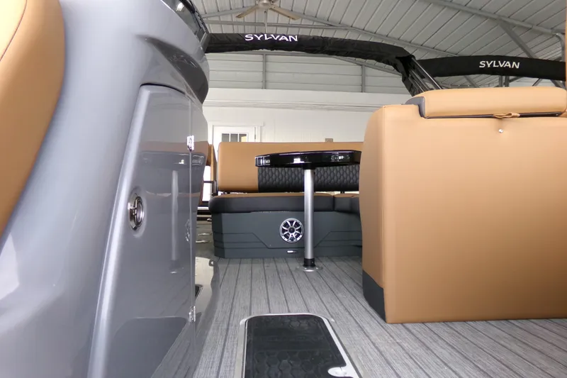 Slide: The Image of 2026 Sylvan L3 DLZ Bar interior with tan seating and sleek design. - 9