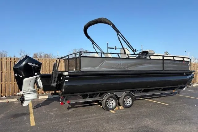 Slide: The Image of 2025 Regency 250 DL3 pontoon boat with Mercury outboard engine on trailer. - 11