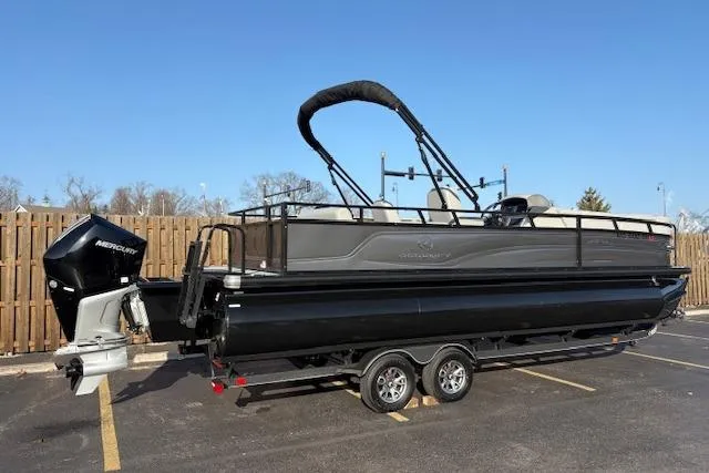 Slide: The Image of 2025 Regency 250 DL3 pontoon boat with Mercury outboard motor on trailer. - 12