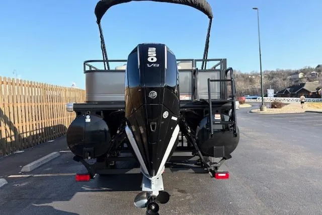 Slide: The Image of 2025 Regency 250 DL3 pontoon boat with powerful 350 V8 engine, parked outdoors. - 15