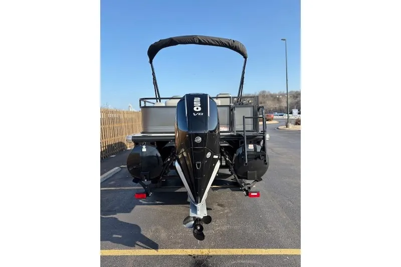 Slide: The Image of 2025 Regency 250 DL3 pontoon boat with powerful V8 engine, parked outdoors. - 16