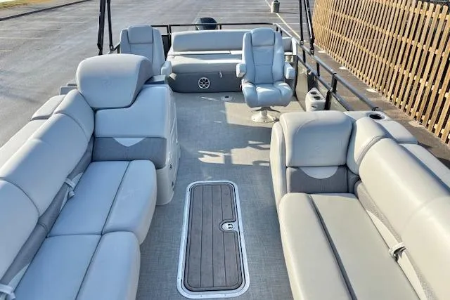 Slide: The Image of 2025 Regency 250 DL3 pontoon boat interior with luxurious seating and modern design. - 26