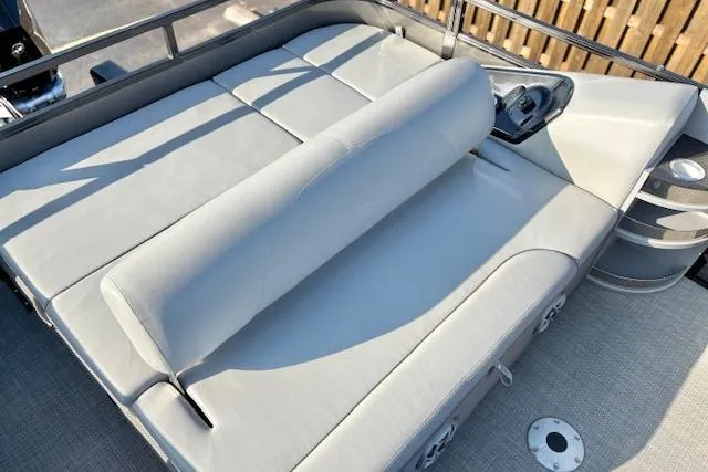 Slide: The Image of 2025 Regency 250 DL3 pontoon boat with luxurious seating and modern design. - 27