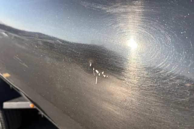 Slide: The Image of 2025 Regency 250 DL3 with visible surface scratches and sunlight reflection. - 7