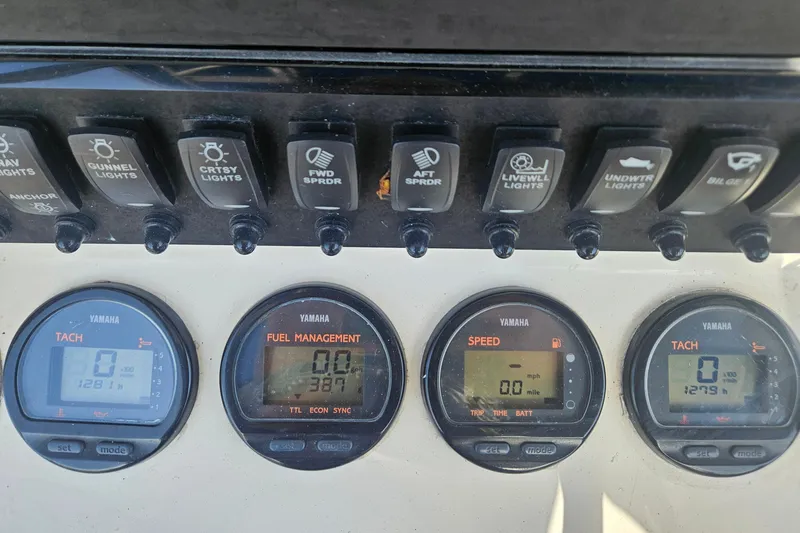 Slide: The Image of Dashboard of a 2006 Key West 268 Center Console boat with Yamaha gauges and switches. - 12