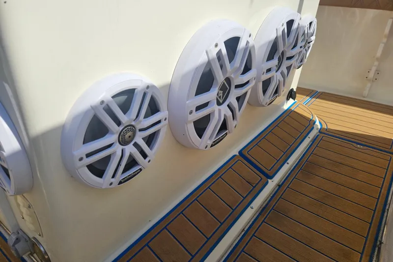 Slide: The Image of 2006 Key West 268 Center Console boat with marine speakers and teak flooring. - 14