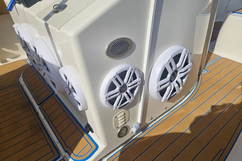 Slide: The Image of 2006 Key West 268 Center Console boat with marine speakers on deck. - 16