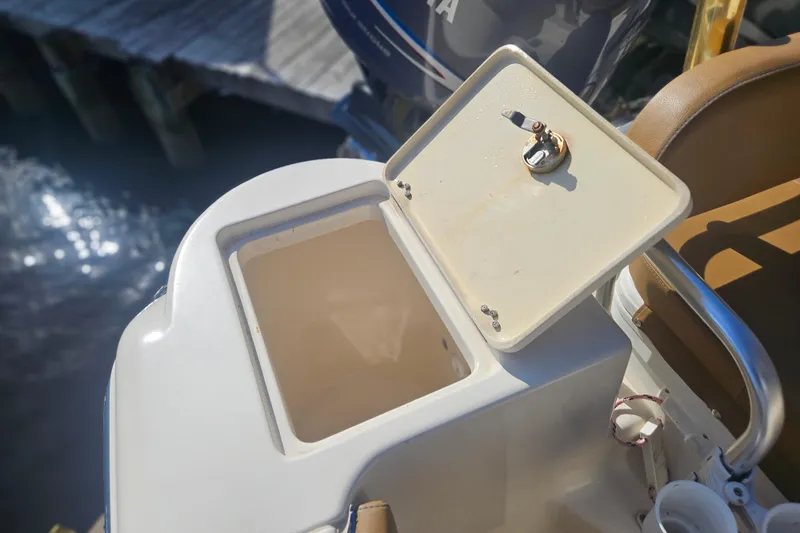 Slide: The Image of Open storage compartment on 2006 Key West 268 Center Console boat. - 7