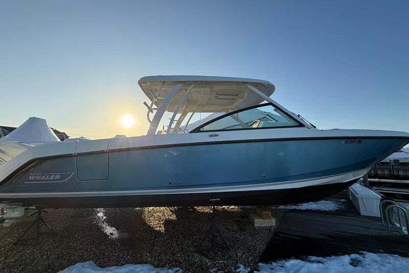 The Image of 2017 Boston Whaler 320 Vantage boat docked at sunset. - 0