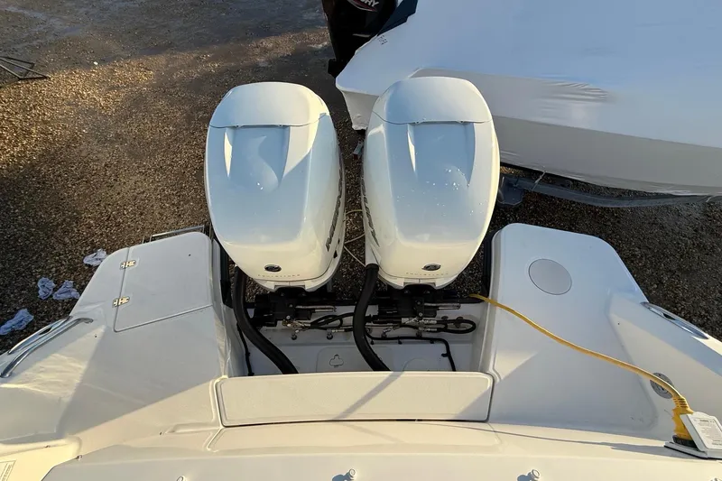 Slide: The Image of 2017 Boston Whaler 320 Vantage with dual outboard engines, viewed from above. - 12
