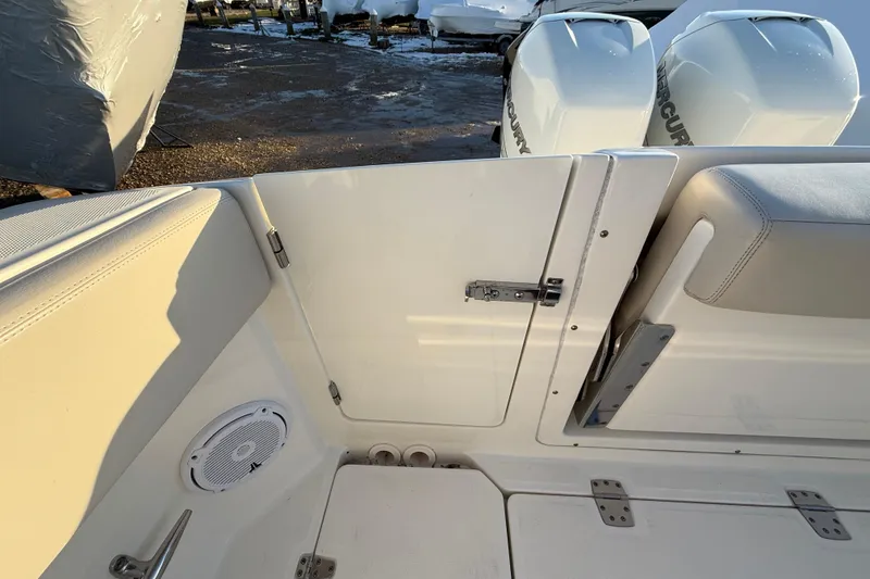 Slide: The Image of 2017 Boston Whaler 320 Vantage boat interior with seating and Mercury engines. - 13