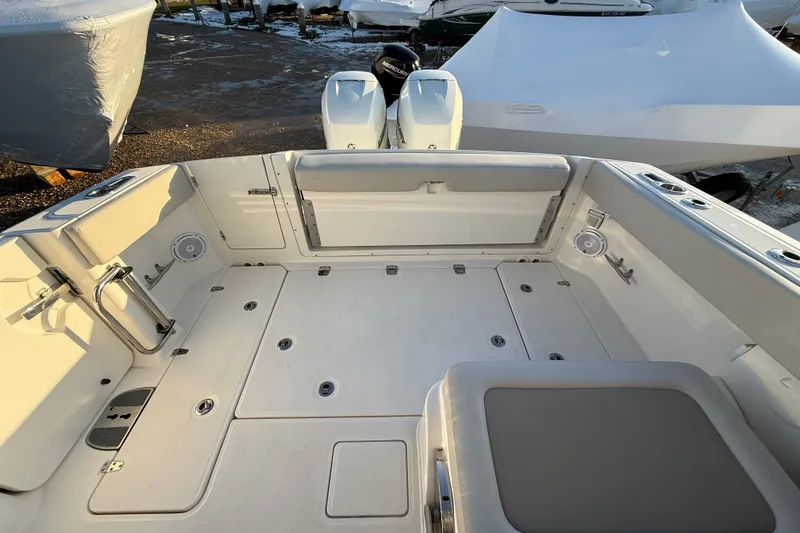 Slide: The Image of 2017 Boston Whaler 320 Vantage boat deck with seating and storage compartments. - 15