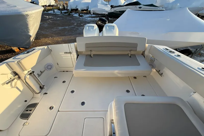 Slide: The Image of 2017 Boston Whaler 320 Vantage boat interior with seating and storage compartments. - 16