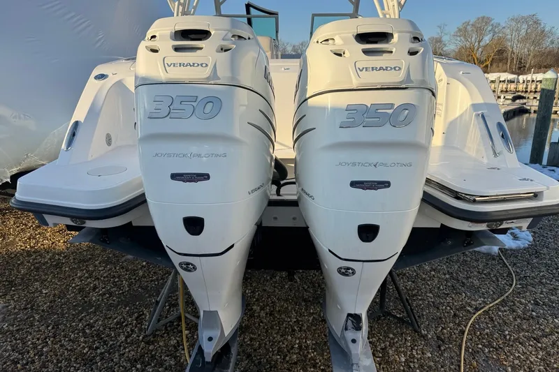 Slide: The Image of 2017 Boston Whaler 320 Vantage with twin 350 Verado engines, docked outdoors. - 3