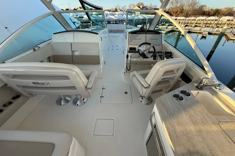 Slide: The Image of 2017 Boston Whaler 320 Vantage boat interior with helm, seating, and console. - 34