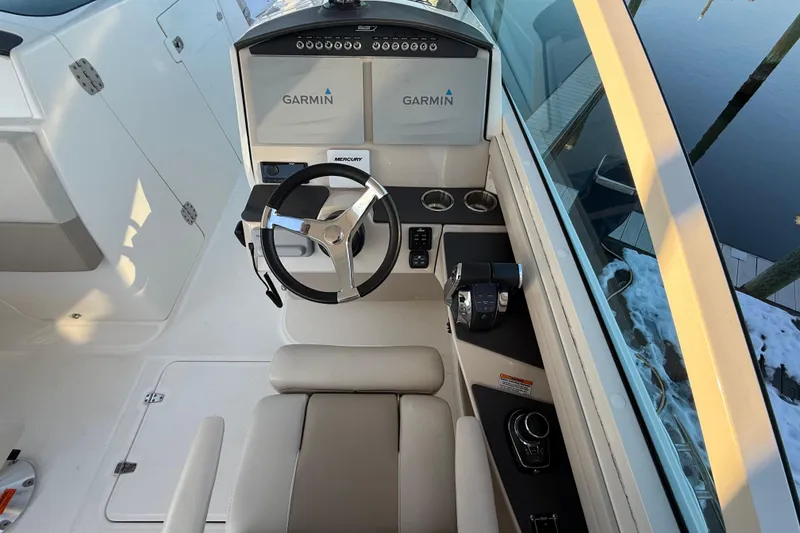 Slide: The Image of 2017 Boston Whaler 320 Vantage helm with Garmin displays and Mercury controls. - 37