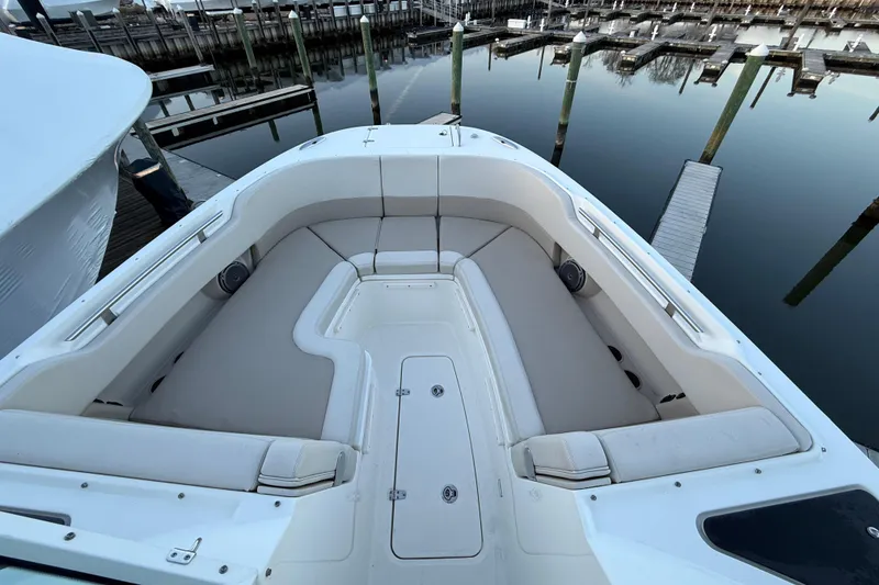 Slide: The Image of 2017 Boston Whaler 320 Vantage boat interior with spacious seating at dock. - 55