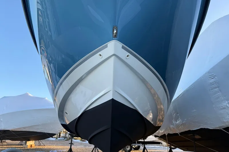 Slide: The Image of 2017 Boston Whaler 320 Vantage boat hull, close-up view, in storage. - 9