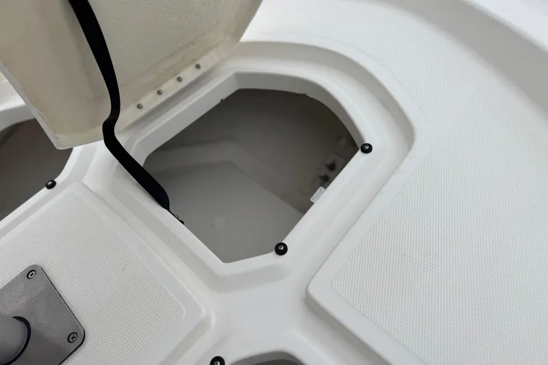 Slide: The Image of Open storage compartment on 2017 Bayliner Element F18 boat deck. - 11